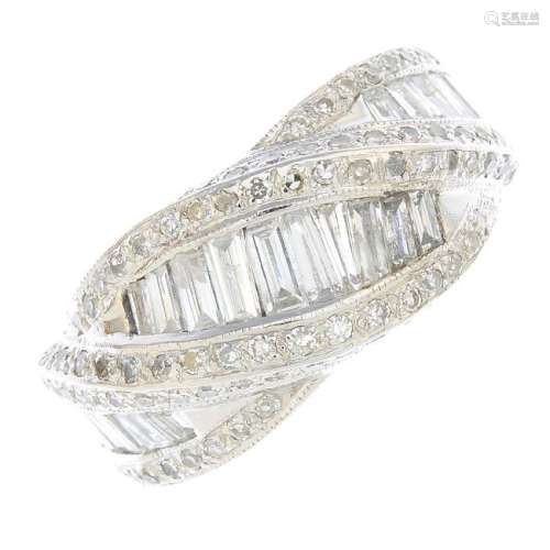 An 18ct gold diamond dress ring. Of asymmetric design,