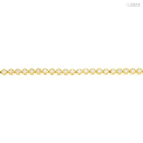 A 14ct gold cubic zirconia bracelet. The circular-shape