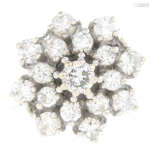 A diamond cluster ring. Designed as a brilliant-cut