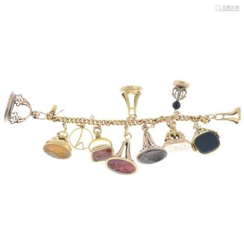 A charm bracelet. Designed as a curb-link chain,