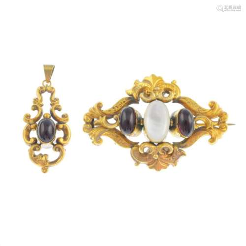 A mid Victorian gold garnet and mother-of pearl brooch