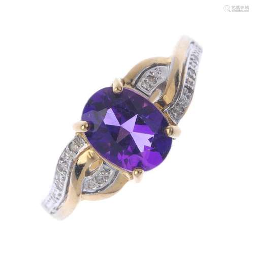 A 9ct gold amethyst and diamond dress ring. The