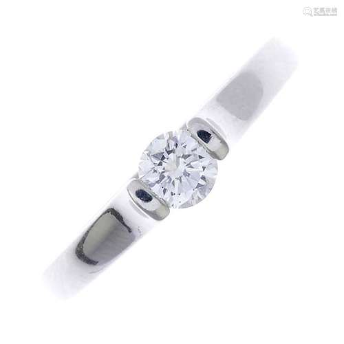 An 18ct gold diamond single-stone ring. The