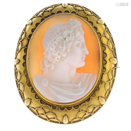 A late Victorian gold cameo brooch. The oval cameo,