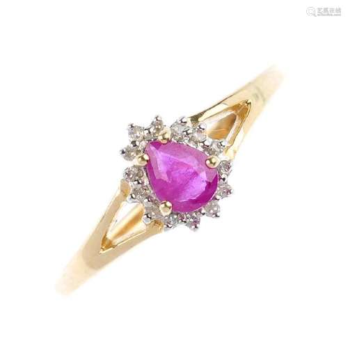 A 9ct gold ruby and diamond cluster ring. The