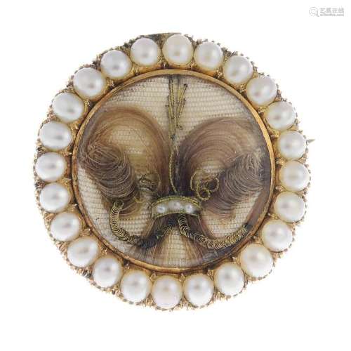 A late Victorian gold split pearl memorial brooch. The