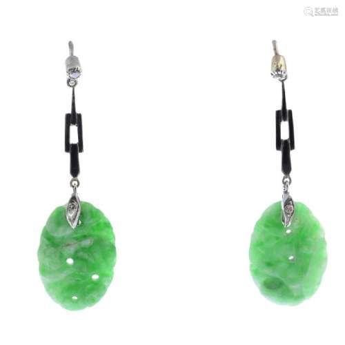 A pair of jade and diamond drop earrings. Each designed