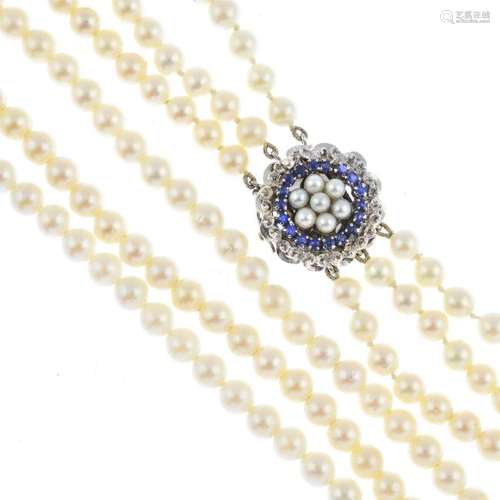 A cultured pearl three-strand necklace. Comprising