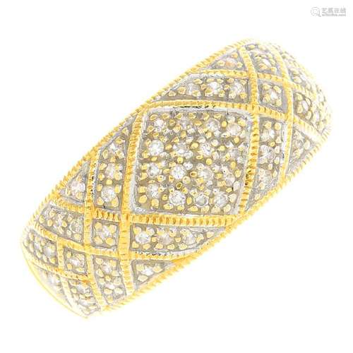 A 9ct gold diamond band ring. Of geometric design, set