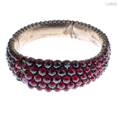 Two pieces of foil-back garnet jewellery. To include a