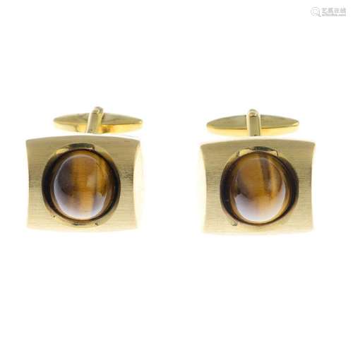 A pair of 9ct gold tiger-eye cufflinks. Each designed