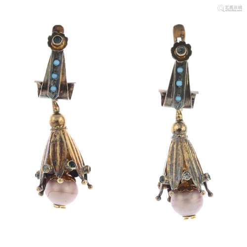 A pair of gold gem-set earrings. Each designed as an