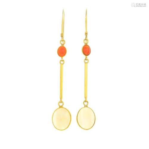 A pair of garnet and opal earrings. Each designed as an