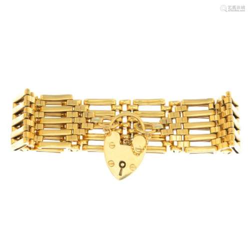 A 9ct gold 1960s gate bracelet. Designed as series of