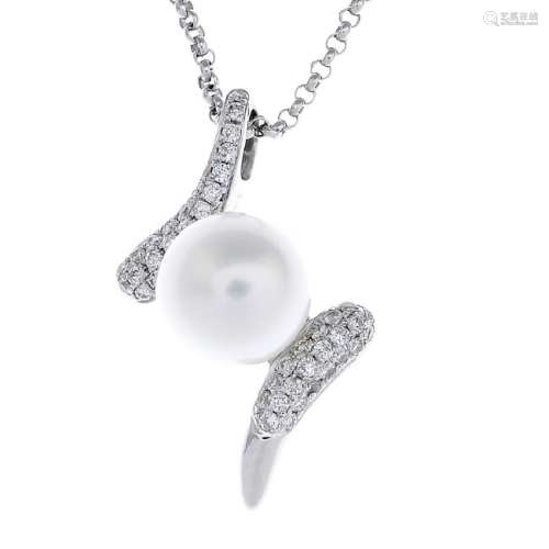 An 18ct gold cultured pearl and diamond pendant. The