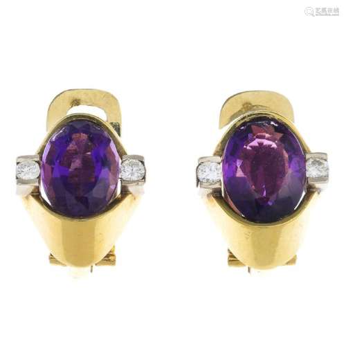 A pair of amethyst and diamond earrings. Each of