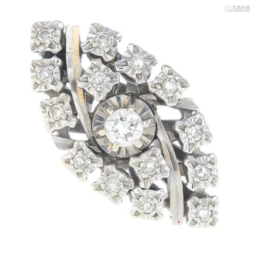 A diamond cluster ring. Of marquise outline, the