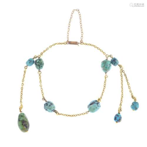 An early 20th century gold turquoise bracelet. Designed