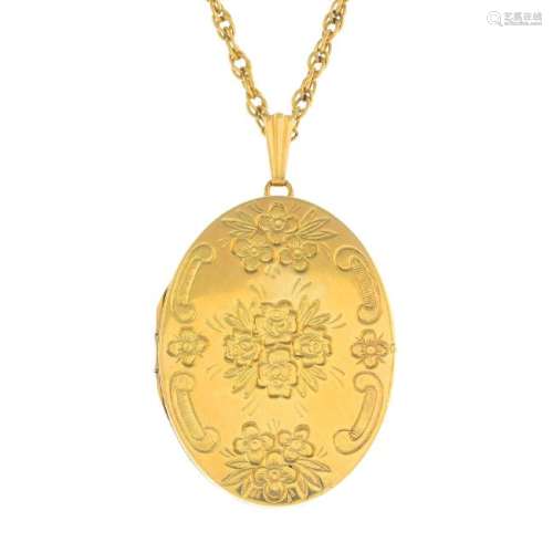 A 9ct gold locket pendant. Of oval outline, with