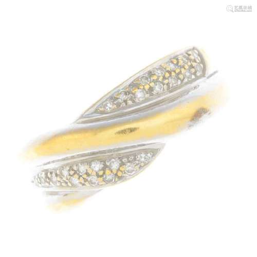 An 18ct gold diamond band ring. Of asymmetric design,
