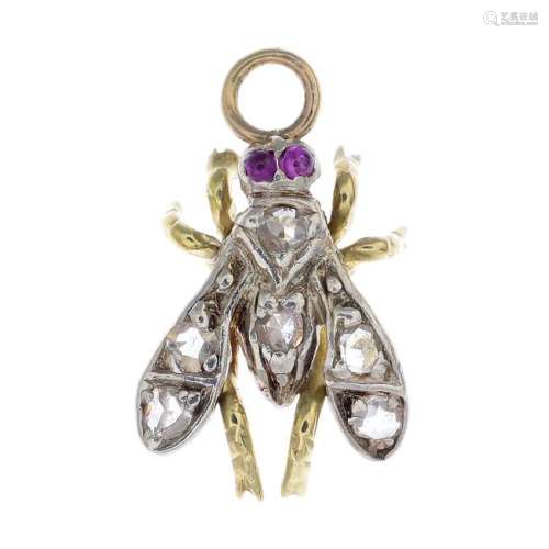 A diamond and ruby fly pendant. Designed as a fly, set
