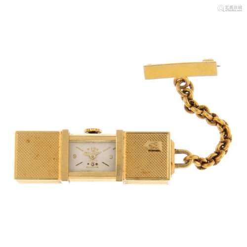 A purse watch by Jean Perret. Yellow metal case,