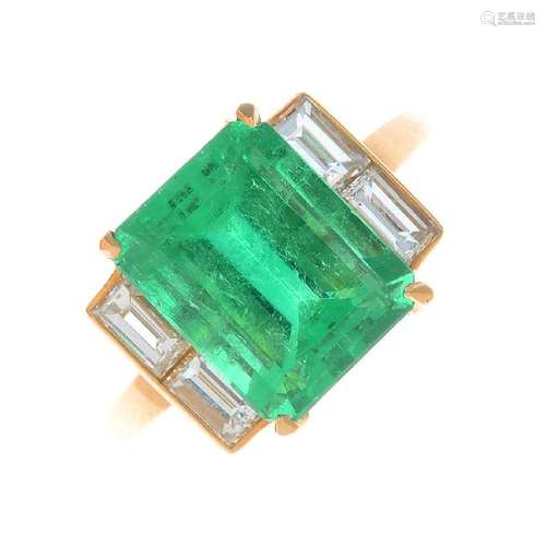 A Colombian emerald and diamond ring. The