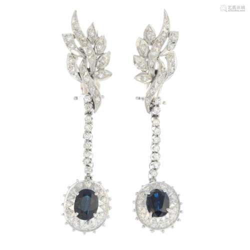A pair of sapphire and diamond earrings. Each designed