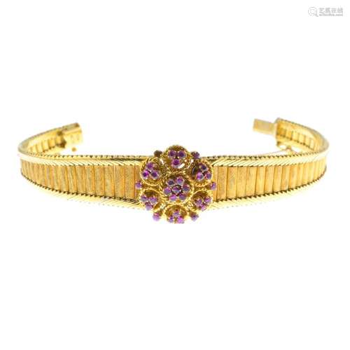 A mid 20th century 18ct gold ruby bracelet. The