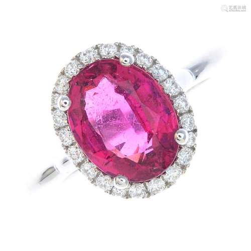 A tourmaline and diamond cluster ring. The oval-shape