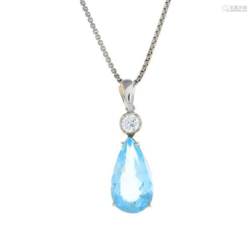 An aquamarine and diamond pendant. The pear-shape