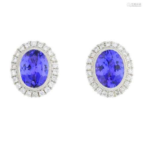 A pair of 18ct gold tanzanite and diamond cluster