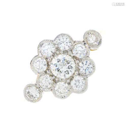 A diamond floral cluster ring. The brilliant-cut