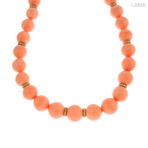 A coral and diamond necklace. Comprising a single