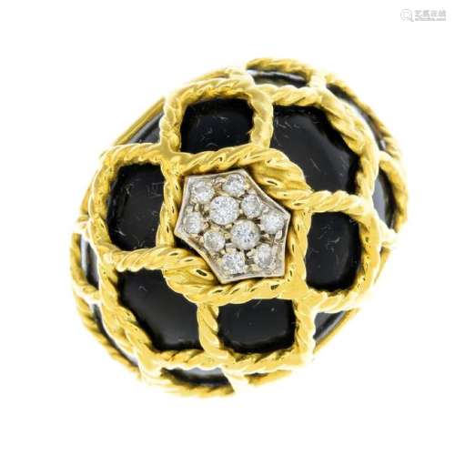 An 18ct gold diamond and enamel ring. Of bombe design,