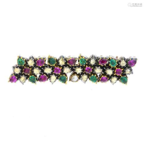 A diamond, emerald and ruby brooch. Designed as a