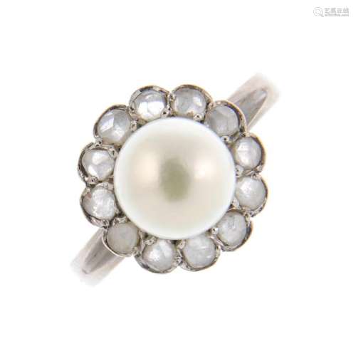 A cultured pearl and diamond cluster ring. The cultured