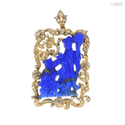 A diamond and lapis lazuli pendant. The carved lapis