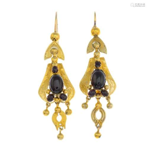 A pair of mid Victorian gold garnet earrings. Each