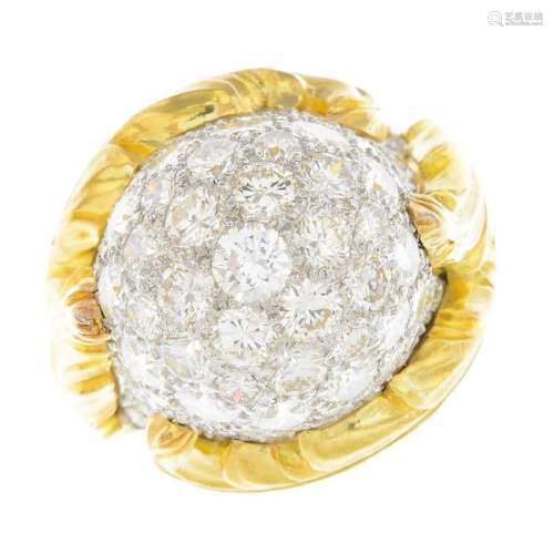 A diamond cocktail ring. Of bombe design, the pave set