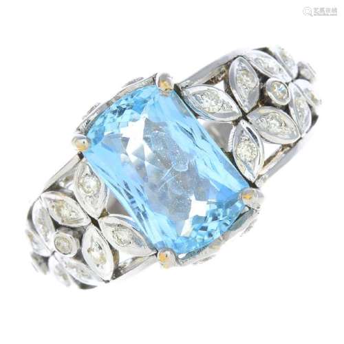 An aquamarine and diamond dress ring. The