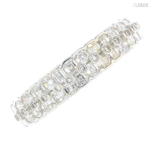A diamond half eternity ring. Designed as a