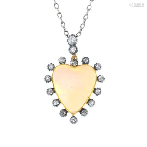 An opal and diamond pendant. Designed as a heart-shape