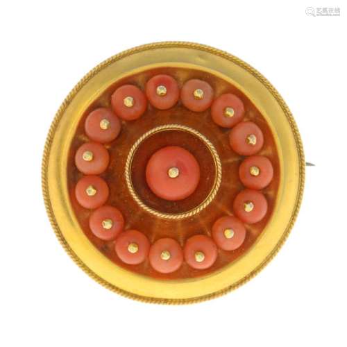 A late Victorian 18ct gold coral brooch. Of circular