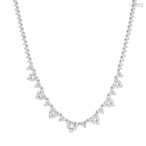 A diamond necklace. Designed as a series of slightly