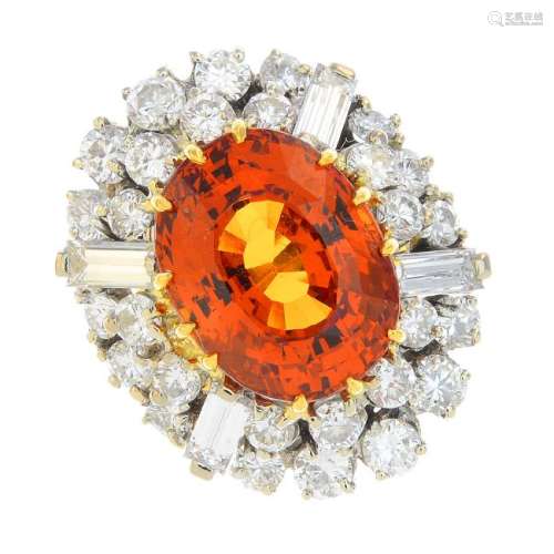 A spessartine garnet and diamond cluster ring. The