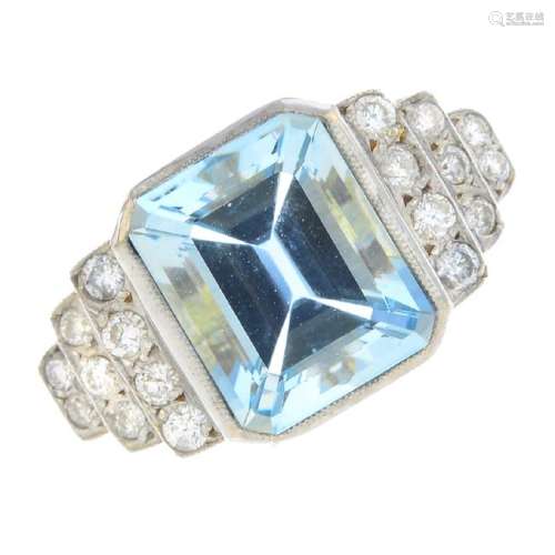 An aquamarine and diamond dress ring. The