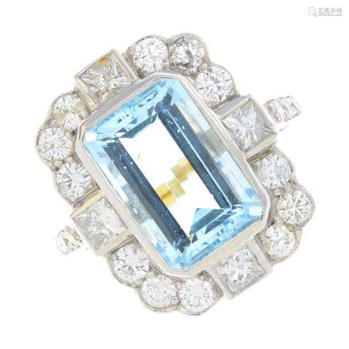 An aquamarine and diamond cluster ring. The