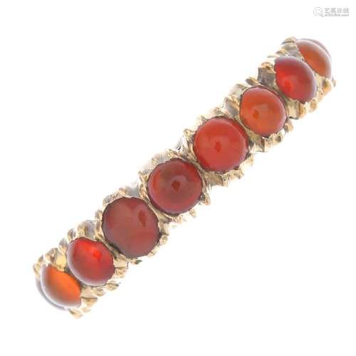 A late Georgian gold carnelian full eternity ring. The