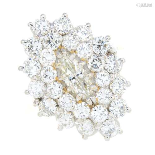 An 18ct gold diamond cluster ring. The marquise-shape